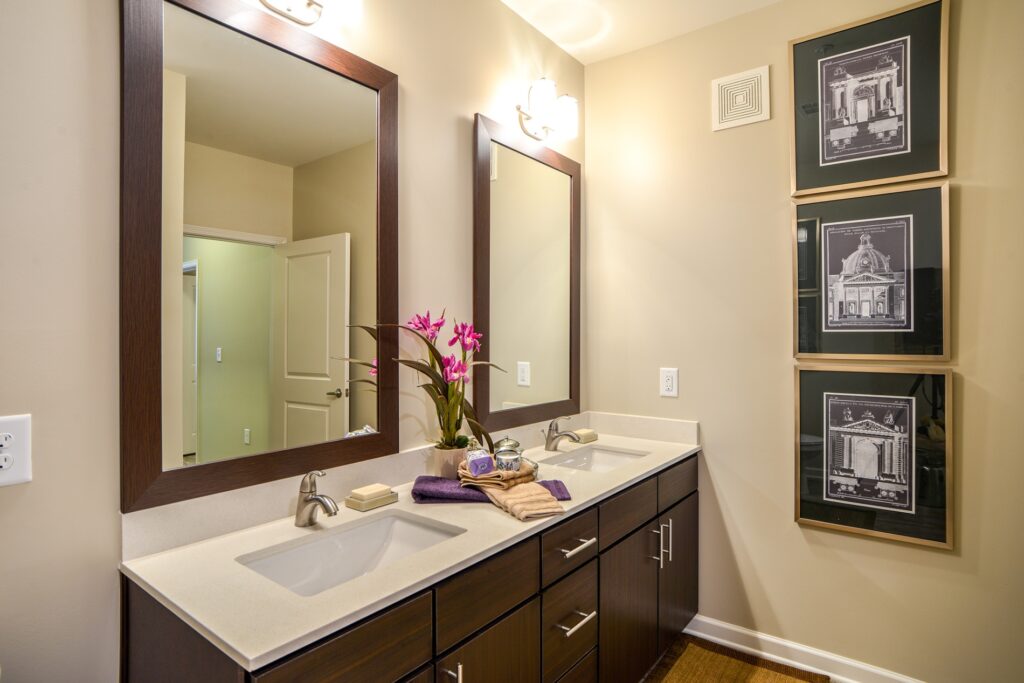 Bathroom with double sinks and 2 large mirrors