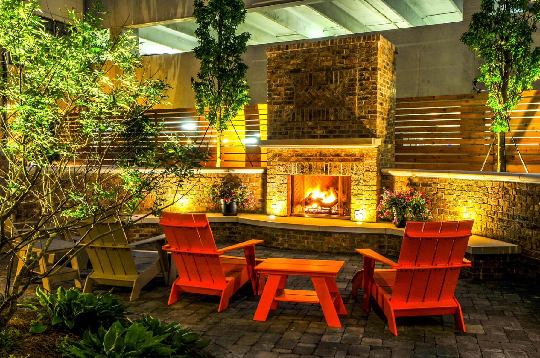 Out door fire place area with chairs and tables